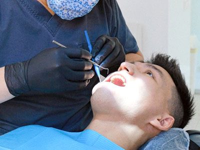 Orthodontics in Dbayeh, Lebanon Dentist treating a young orthodontic patient at C.Metric clinic in Dbayeh